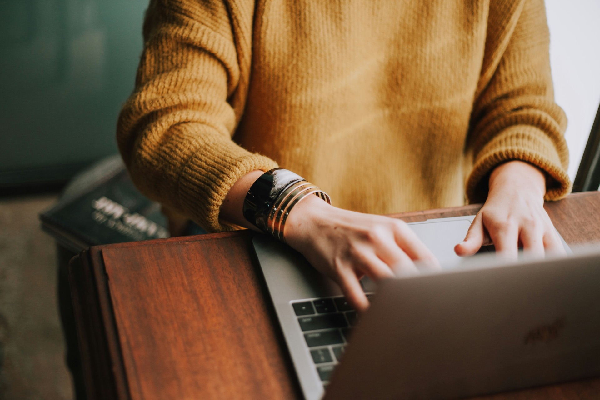 Person working on laptop managing property renewals